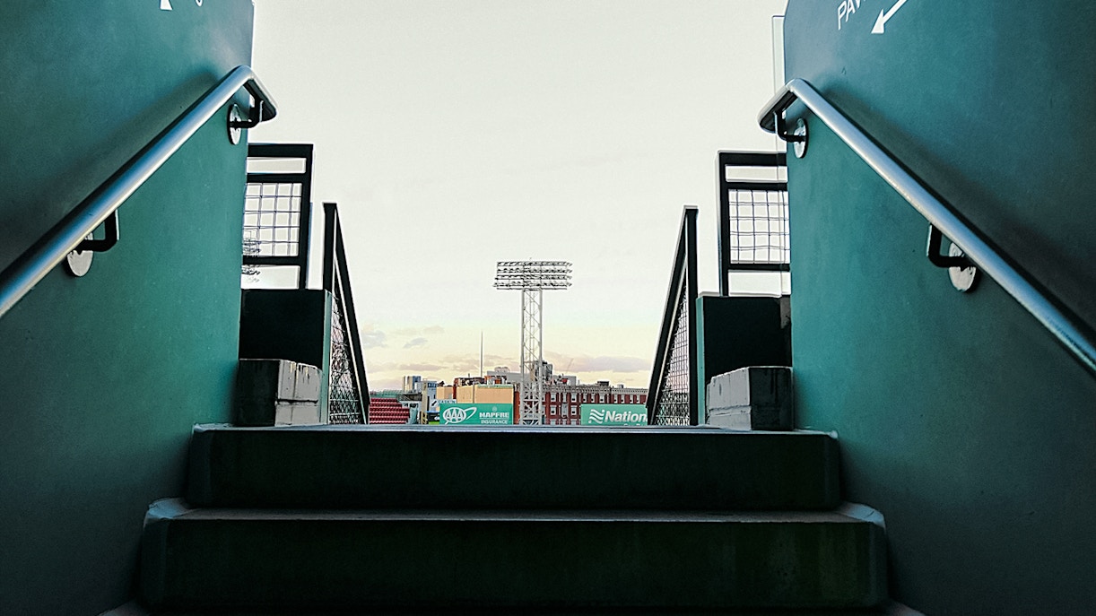 Fenway Park stairs leading to the stadium view with light tower in Boston.