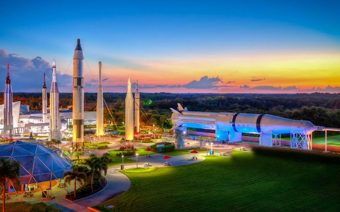 Rocket Garden at Kennedy Space Center with historic rockets at sunset.