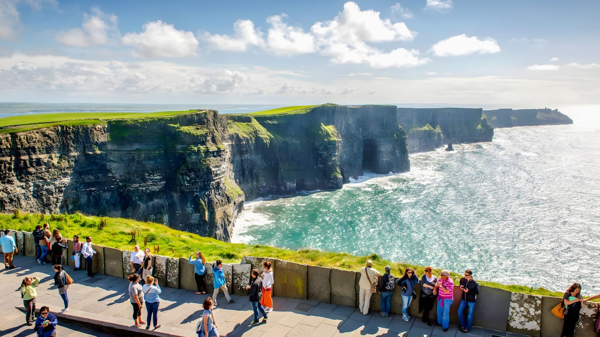 Tourists viewing the Cliffs of Moher in County Clare, Ireland.