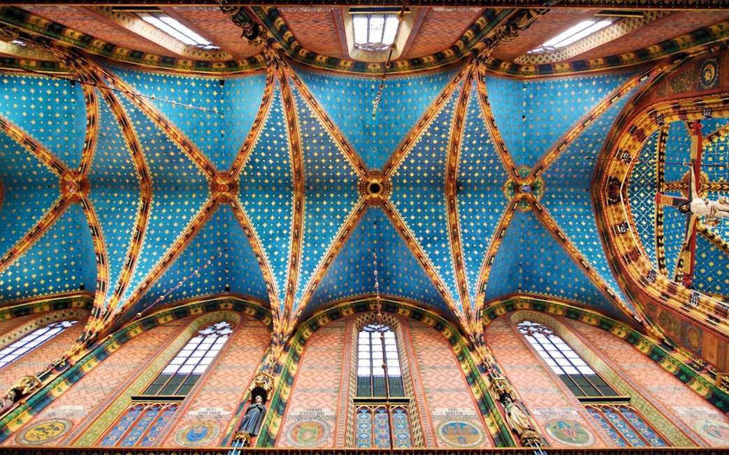 Ceiling of Saint Mary's Basilica in Krakow's Old Town, featuring intricate blue and gold patterns.