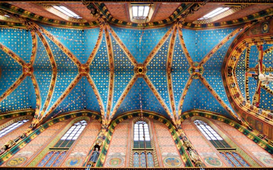 Ceiling of Saint Mary's Basilica in Krakow's Old Town, featuring intricate blue and gold patterns.