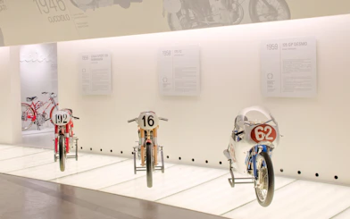 Vintage Ducati motorcycles on display at the Ducati Museum in Bologna.