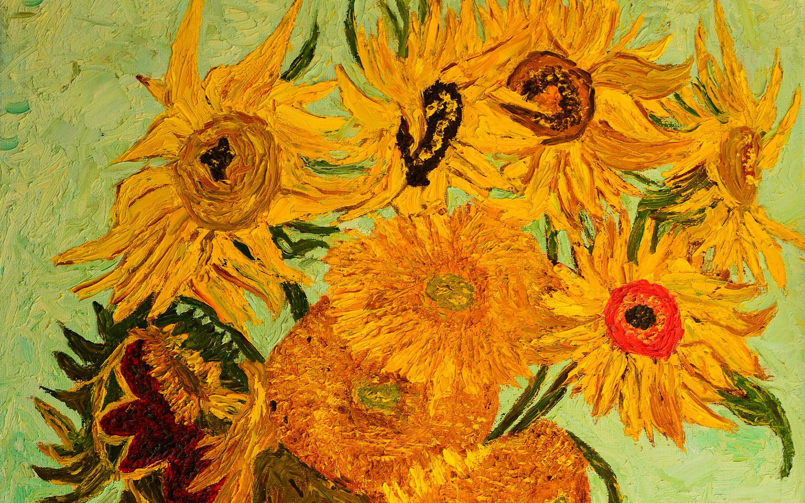 Closeup of Van Gogh's Sunflowers painting with vibrant yellow blooms.
