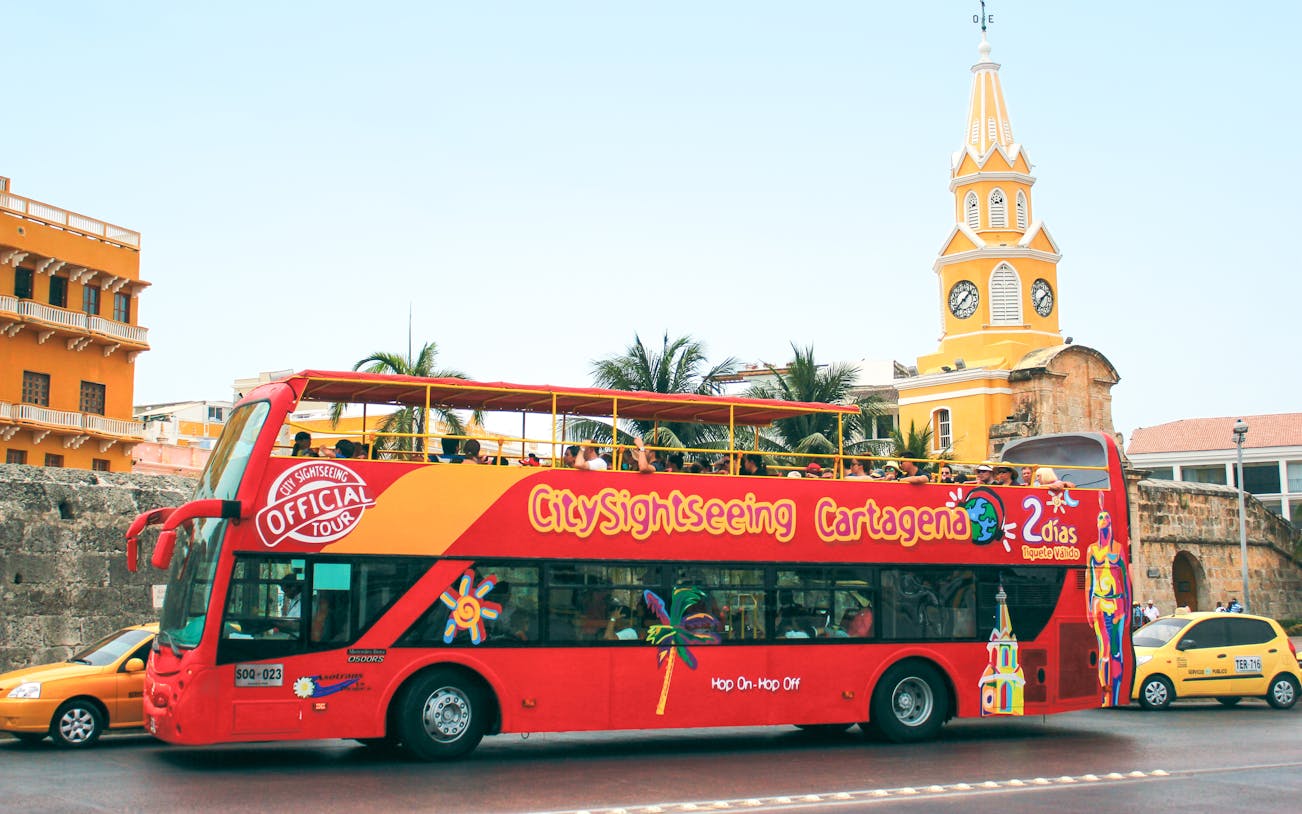 City Sightseeing bus in front of Clock Tower Monument, Cartagena.