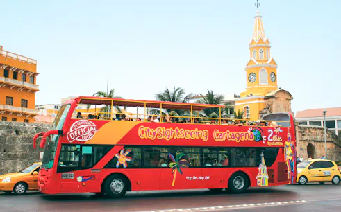 City Sightseeing bus in front of Clock Tower Monument, Cartagena.