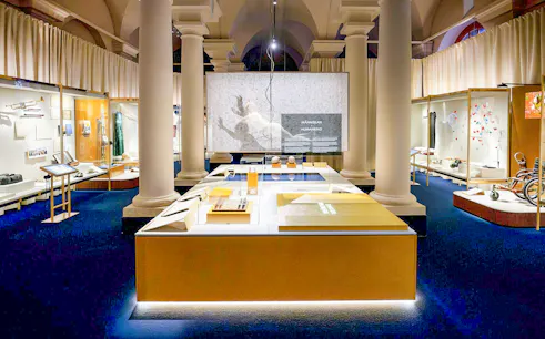 Exhibit hall at the Nobel Prize Museum showcasing historical artifacts and displays.