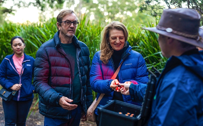 Tour group receiving instructions for Evening Rainforest & Glow Worm Experience.
