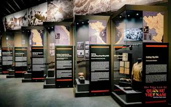 Hanoi Military History Museum exhibit with maps and historical artifacts.
