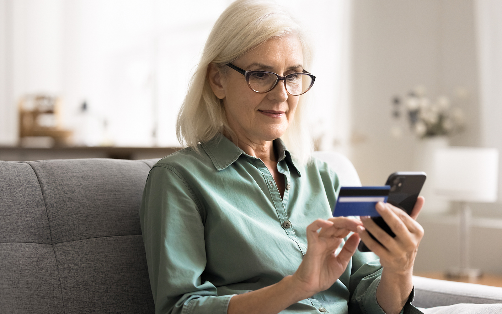 Woman purchasing tickets on smartphone
