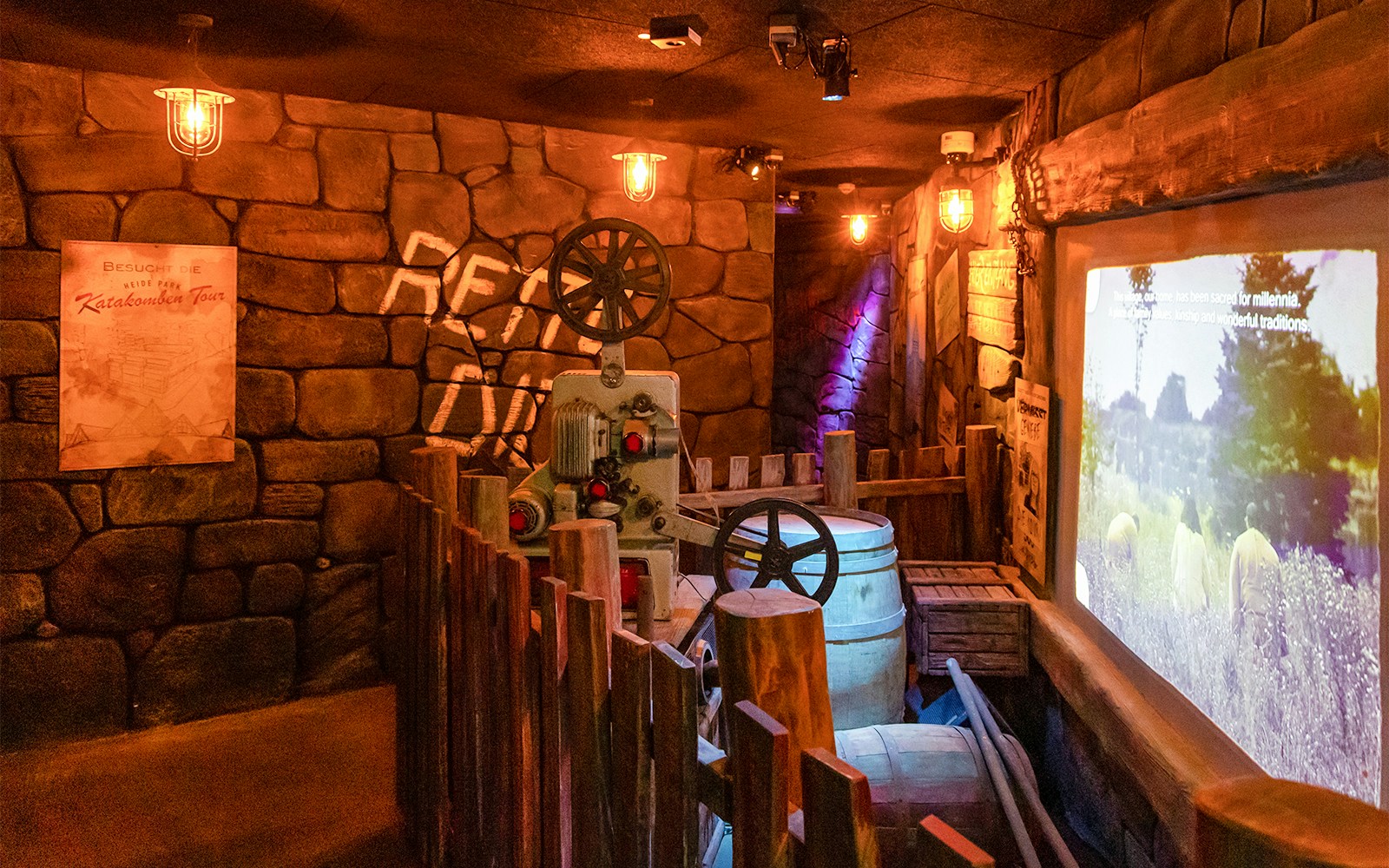 Ghostbusters 5D ride interior at Heide Park Resort, Hamburg, featuring vintage machinery and stone walls.