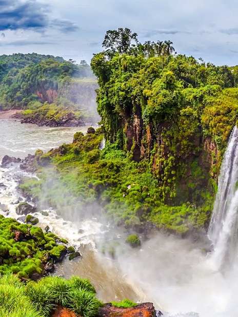 Argentine Falls with lush greenery and cascading water.