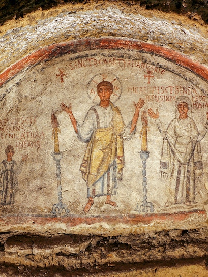 Fresco in the Catacombs of San Gennaro, Naples, depicting early Christian figures.