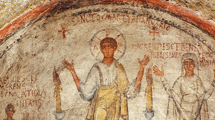 Fresco in the Catacombs of San Gennaro, Naples, depicting early Christian figures.