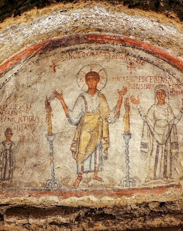 Fresco in the Catacombs of San Gennaro, Naples, depicting early Christian figures.