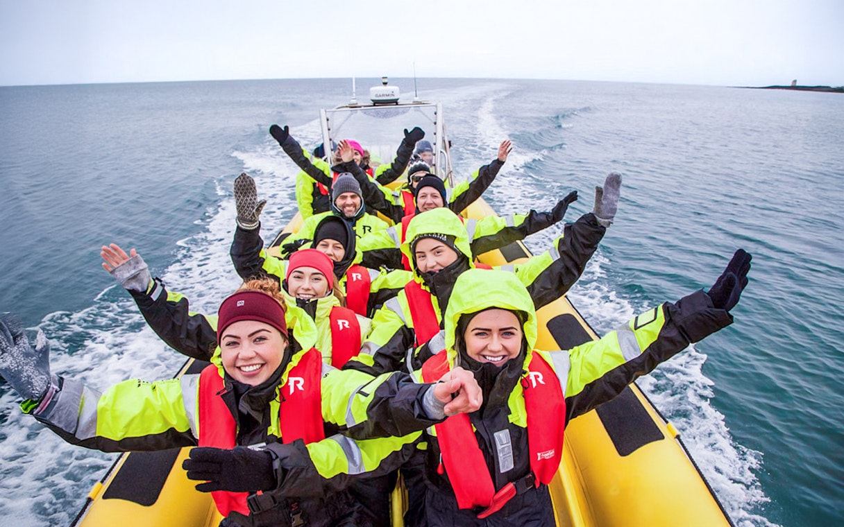 Guests on RIB speedboat tour in Reykjavik, heading to whale watching.
