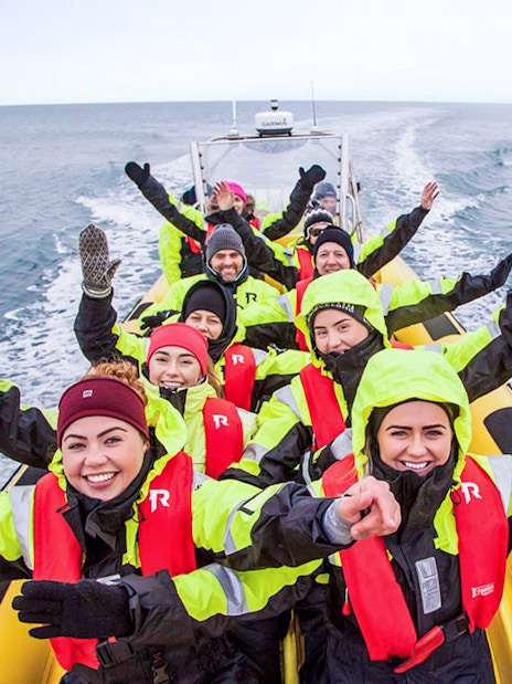 Guests on RIB speedboat tour in Reykjavik, heading to whale watching.