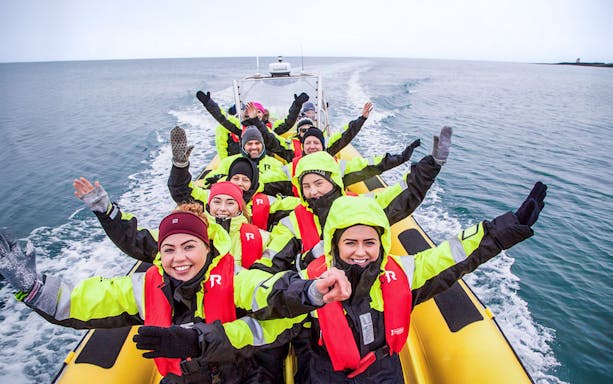 Guests on RIB speedboat tour in Reykjavik, heading to whale watching.