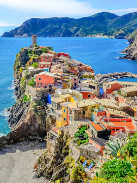 Colorful cliffside village of Vernazza in Cinque Terre, Italy, overlooking the sea.