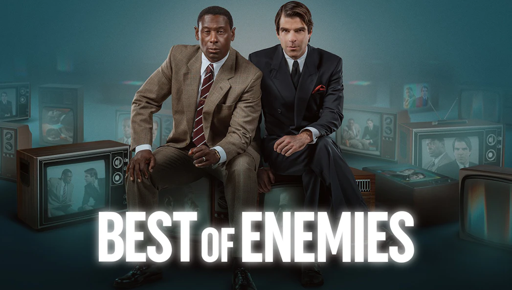 Two men in suits sit surrounded by vintage televisions displaying their images, with "Best of Enemies" text.