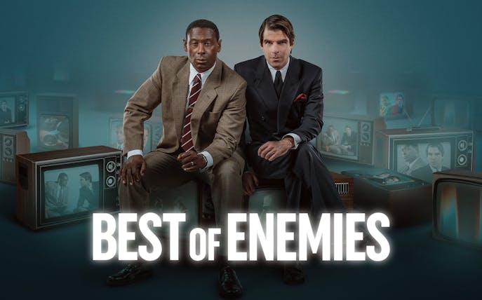 Two men in suits sit surrounded by vintage televisions displaying their images, with "Best of Enemies" text.