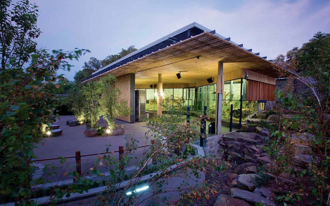 Modern building surrounded by greenery at Adelaide Zoo.