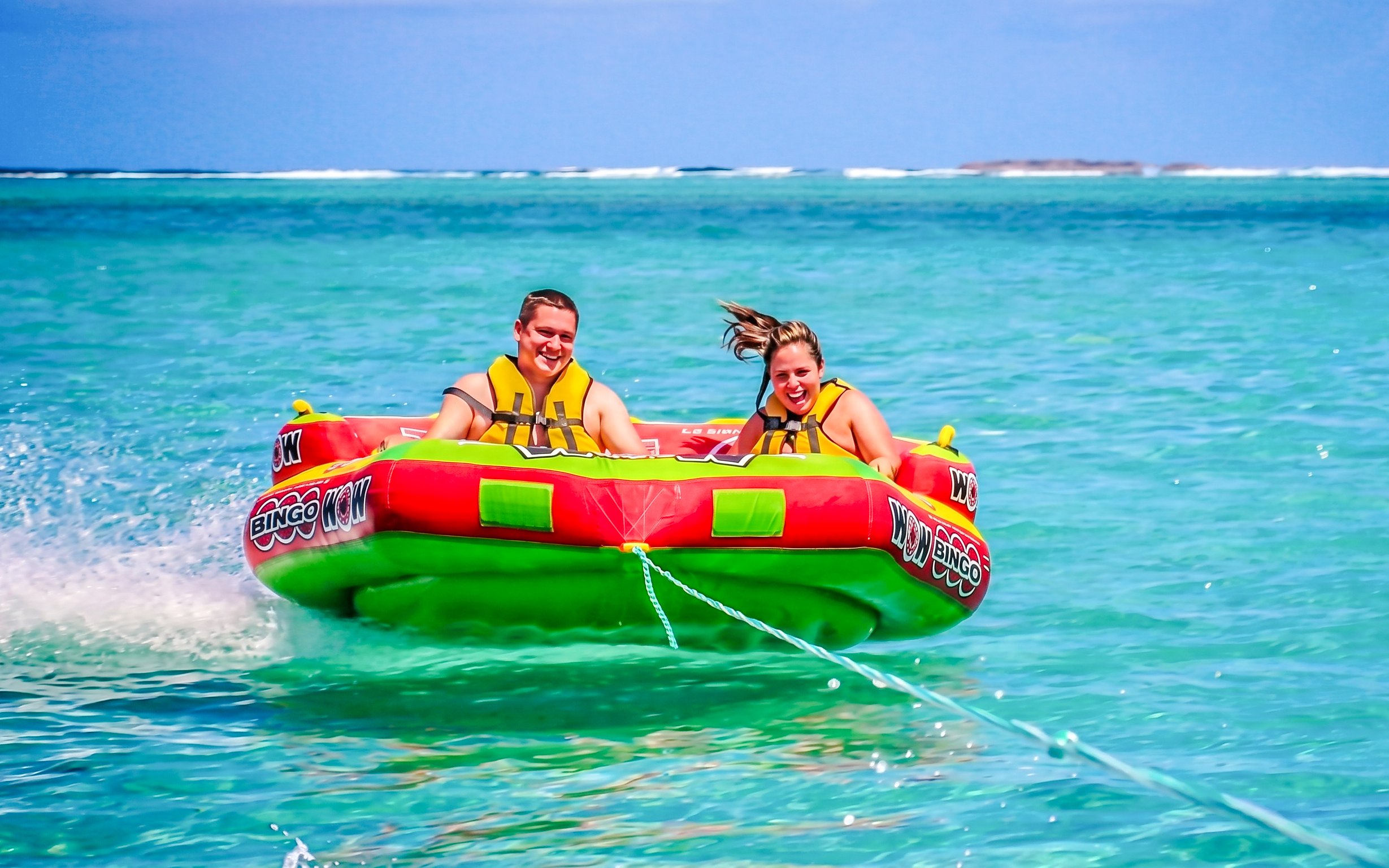 People enjoying a water tubing ride on the east coast of Mauritius.