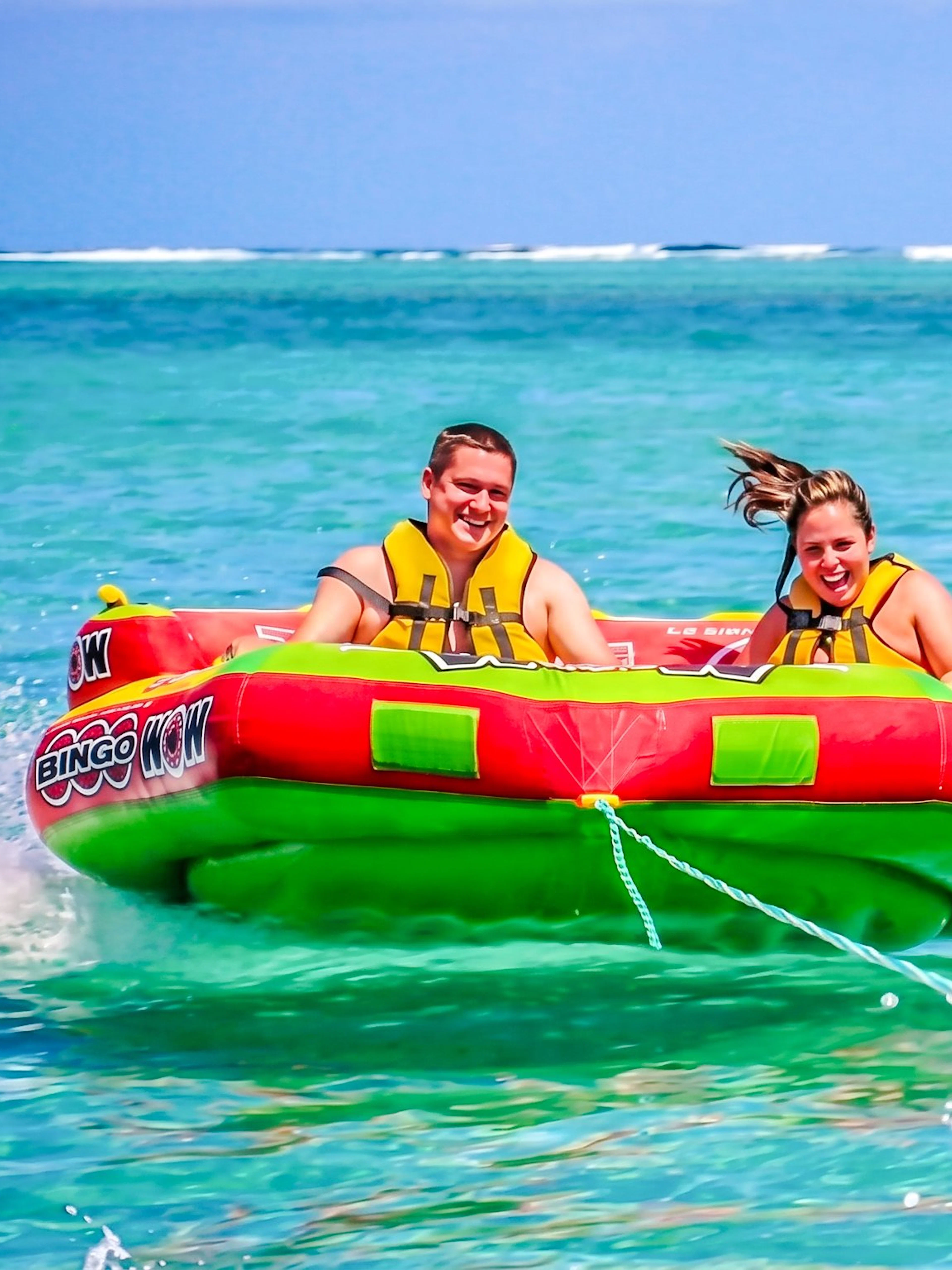 People enjoying a water tubing ride on the east coast of Mauritius.