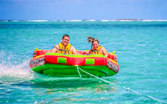 People enjoying a water tubing ride on the east coast of Mauritius.