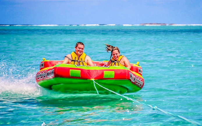 People enjoying a water tubing ride on the east coast of Mauritius.