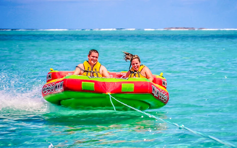 People enjoying a water tubing ride on the east coast of Mauritius.