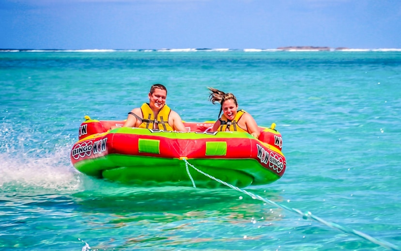 People enjoying a water tubing ride on the east coast of Mauritius.