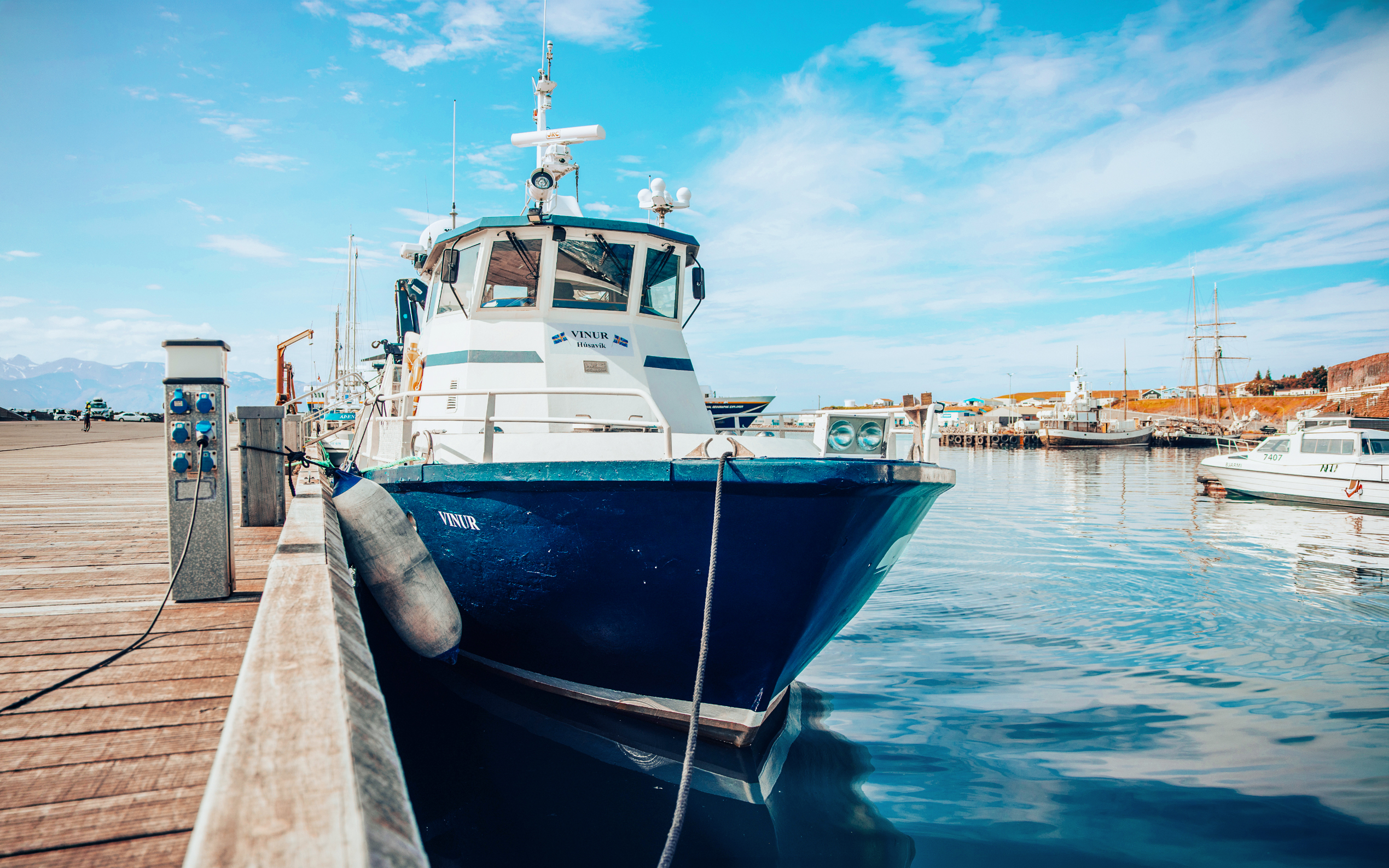 Vinur boat docked for whale spotting cruise in Iceland.