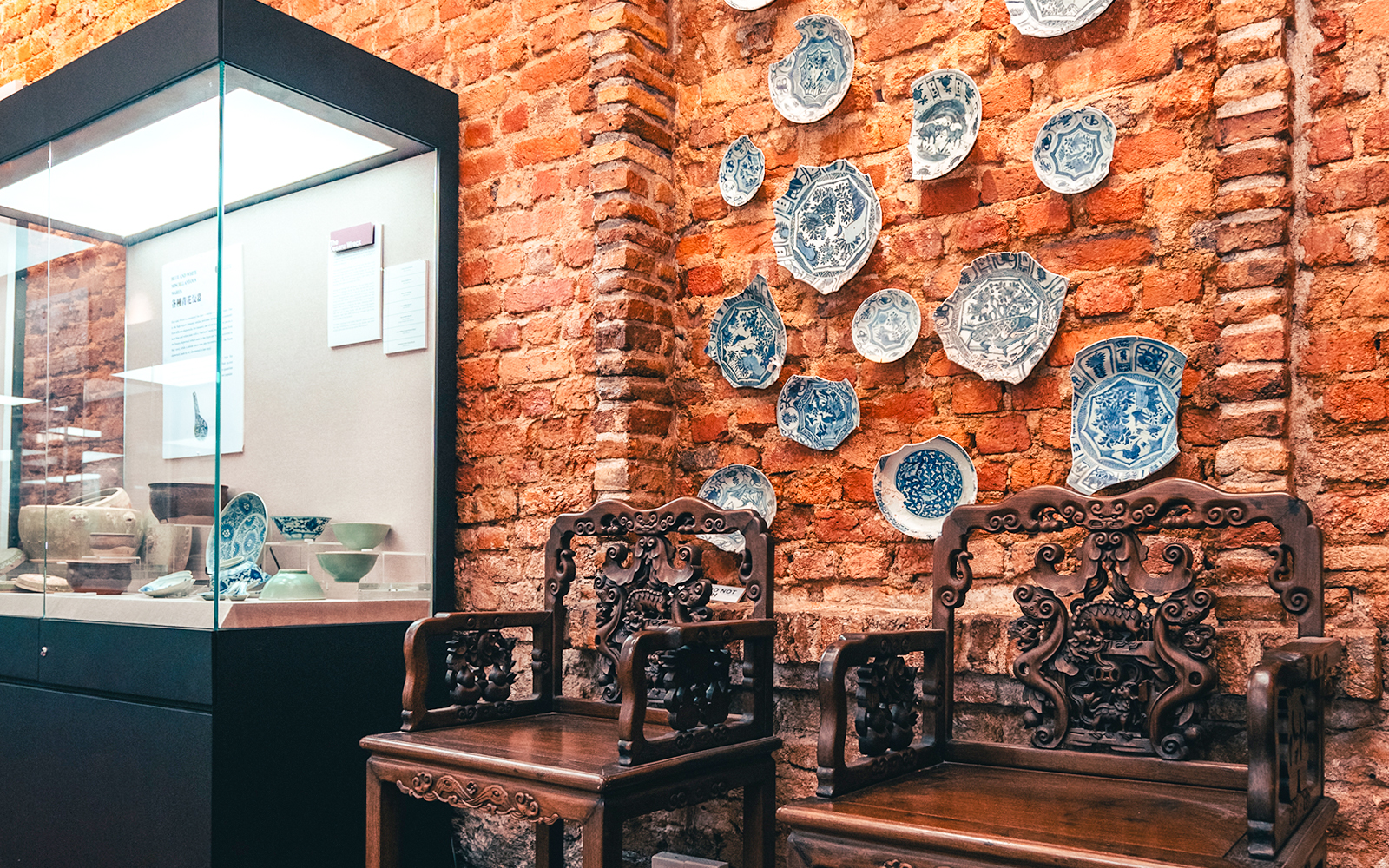 Antique chairs and blue porcelain plates at Straits and Oriental Museum Penang.