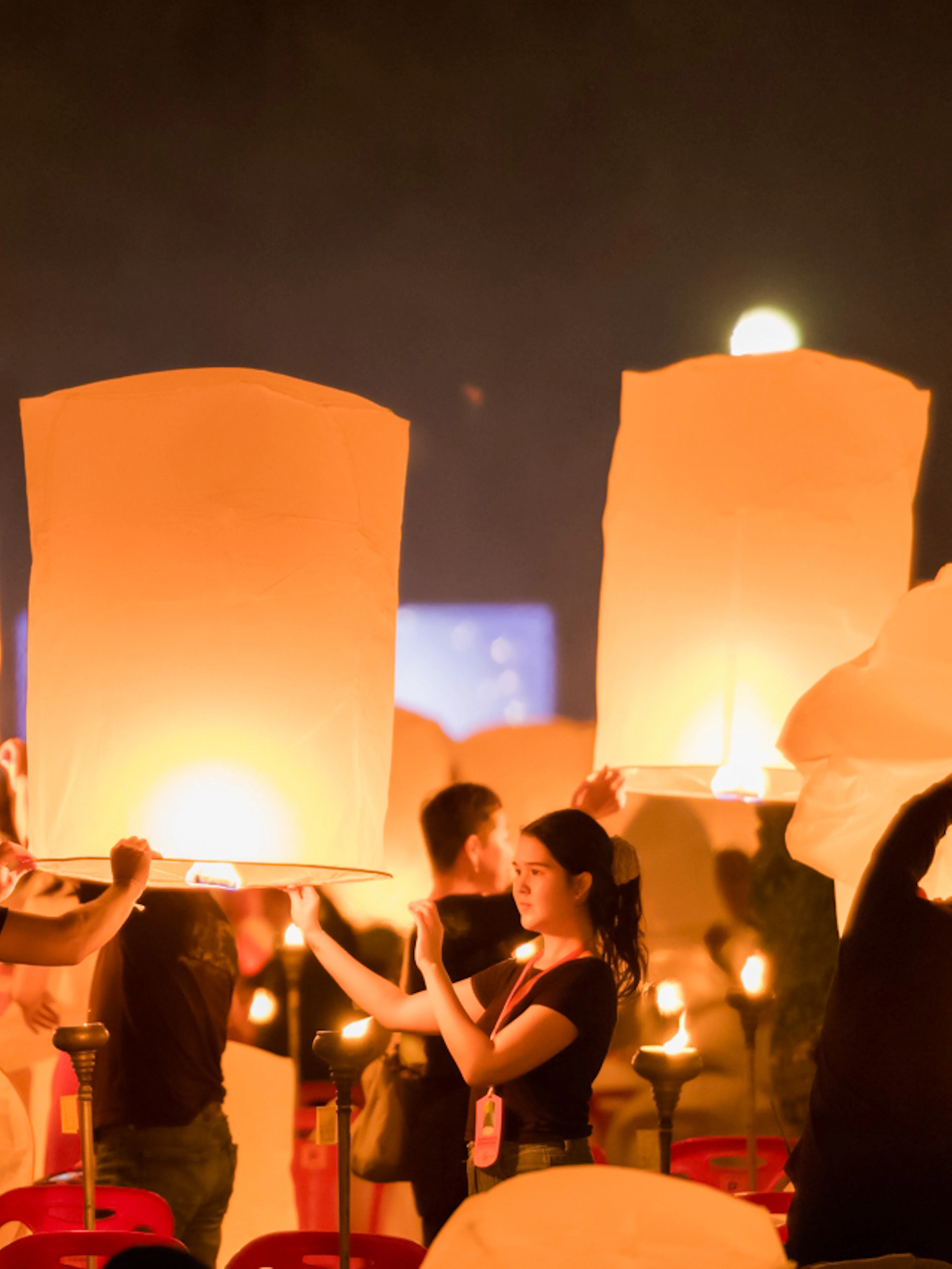 Participants releasing lanterns at Yee Peng Festival, Lanna Thutanka Maejo, Chiang Mai.