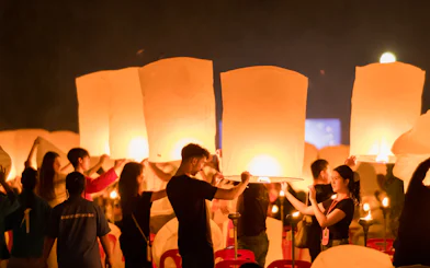 Participants releasing lanterns at Yee Peng Festival, Lanna Thutanka Maejo, Chiang Mai.