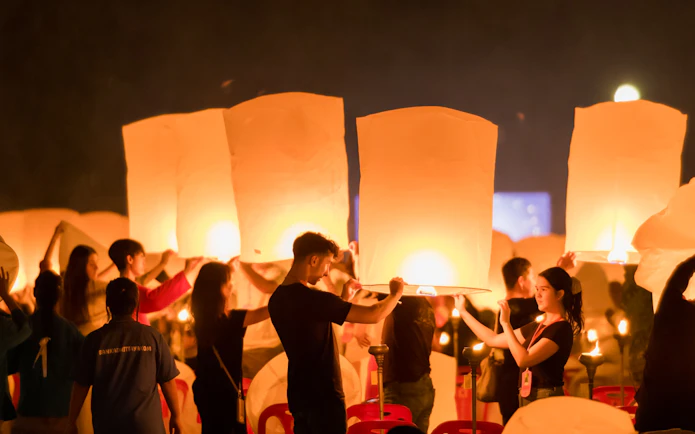 Participants releasing lanterns at Yee Peng Festival, Lanna Thutanka Maejo, Chiang Mai.