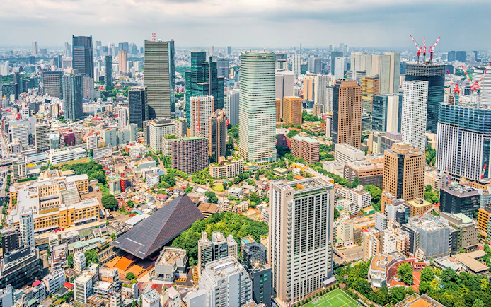 Tokyo cityscape from Tokyo Tower, showcasing skyscrapers and urban landscape.