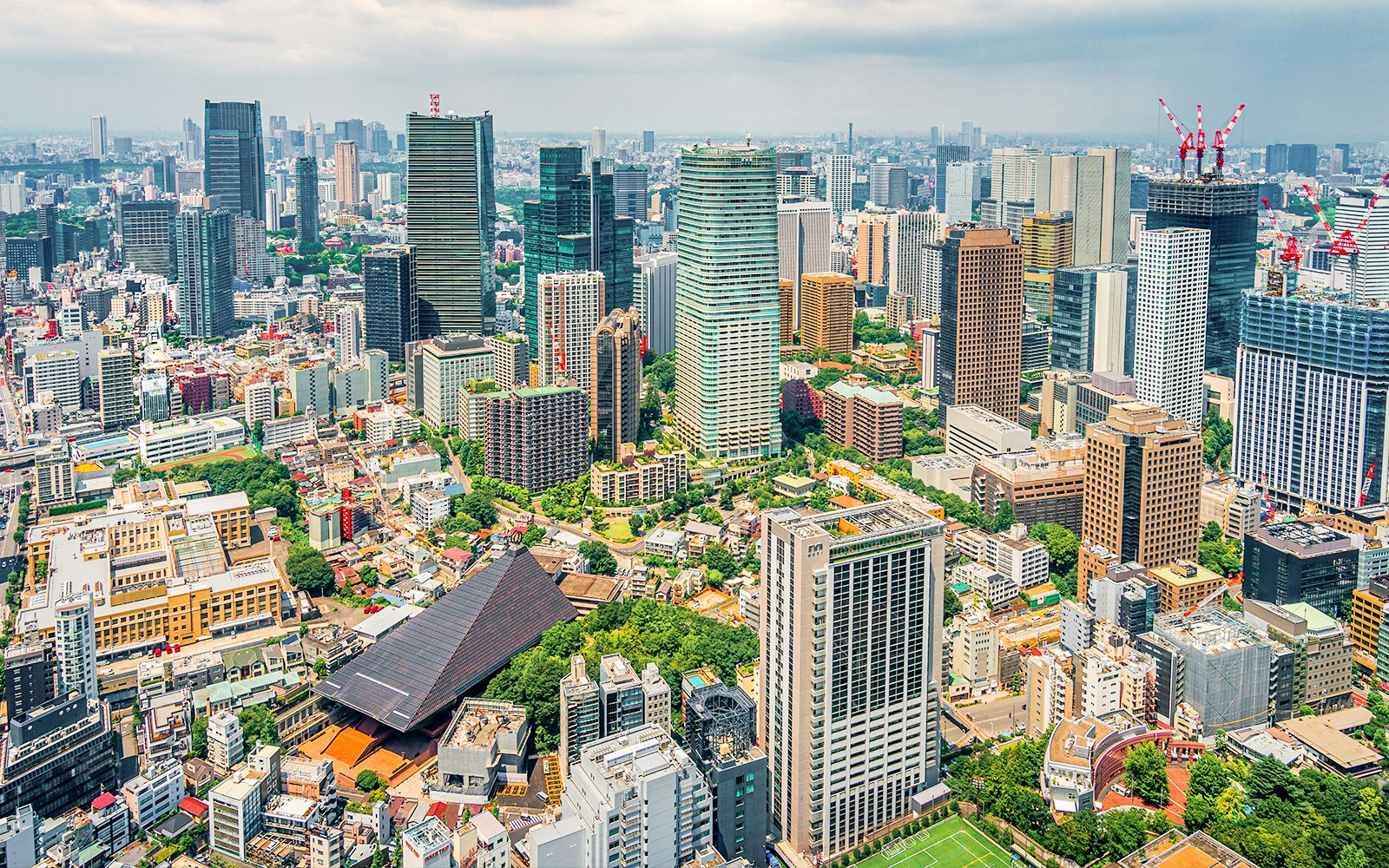 Tokyo cityscape from Tokyo Tower, showcasing skyscrapers and urban landscape.