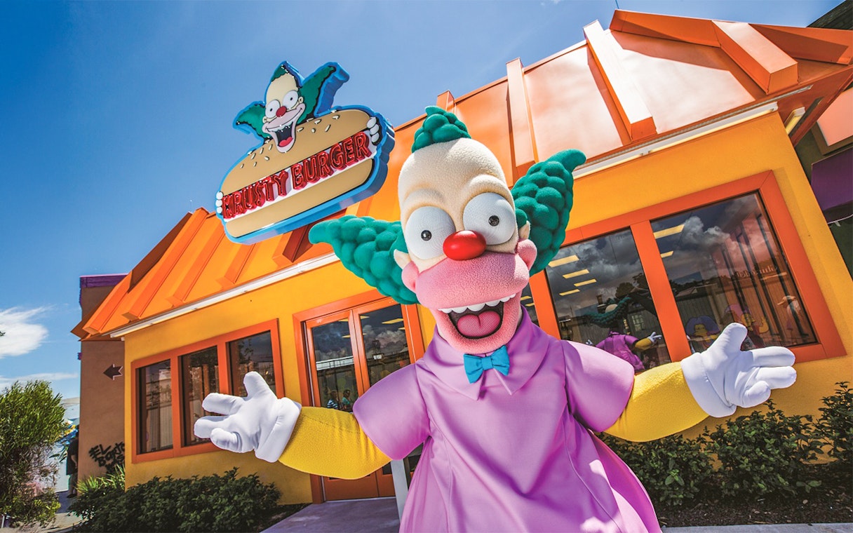 Krusty the Clown in front of Krusty Burger at Krustyland, Universal Studios Orlando.