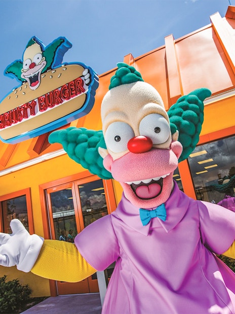 Krusty the Clown in front of Krusty Burger at Krustyland, Universal Studios Orlando.