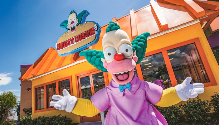 Krusty the Clown in front of Krusty Burger at Krustyland, Universal Studios Orlando.