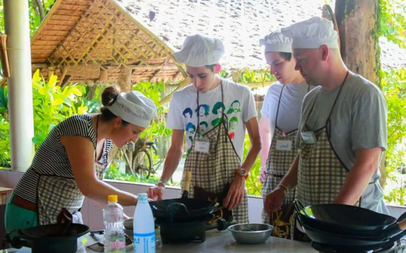 Participants learning Thai cooking at Baan Hongnual, Chiang Mai.