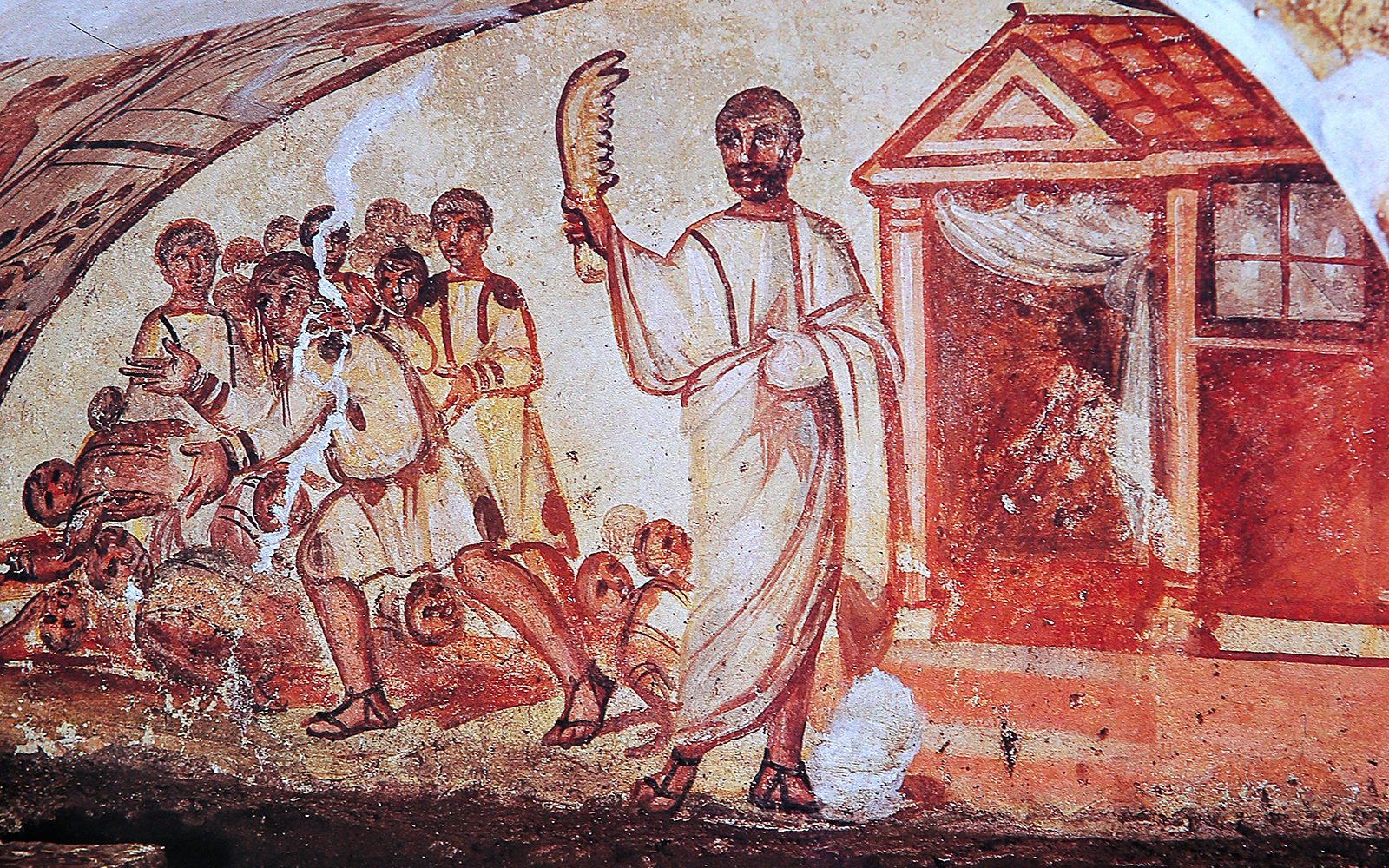 Guided tour inside the Catacombs of San Gennaro, Naples, showcasing ancient frescoes and burial sites.