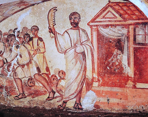 Guided tour inside the Catacombs of San Gennaro, Naples, showcasing ancient frescoes and burial sites.