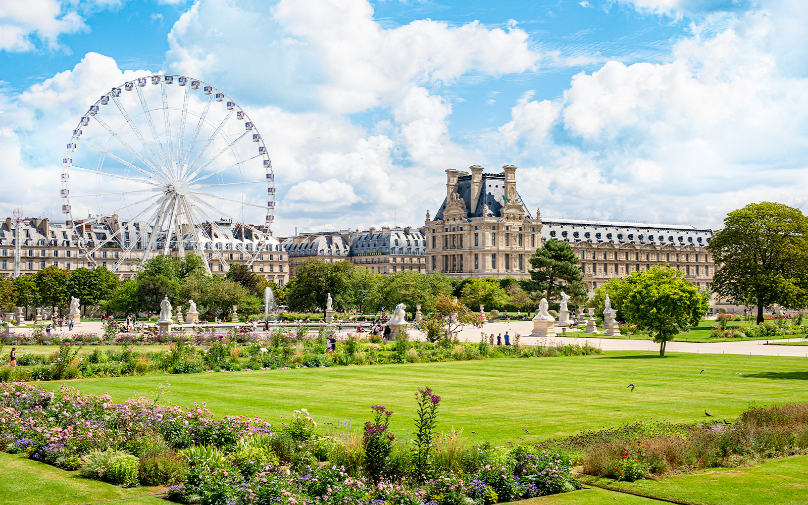 Tuileries Gardens Paris with view of manicured lawns and historic statues.