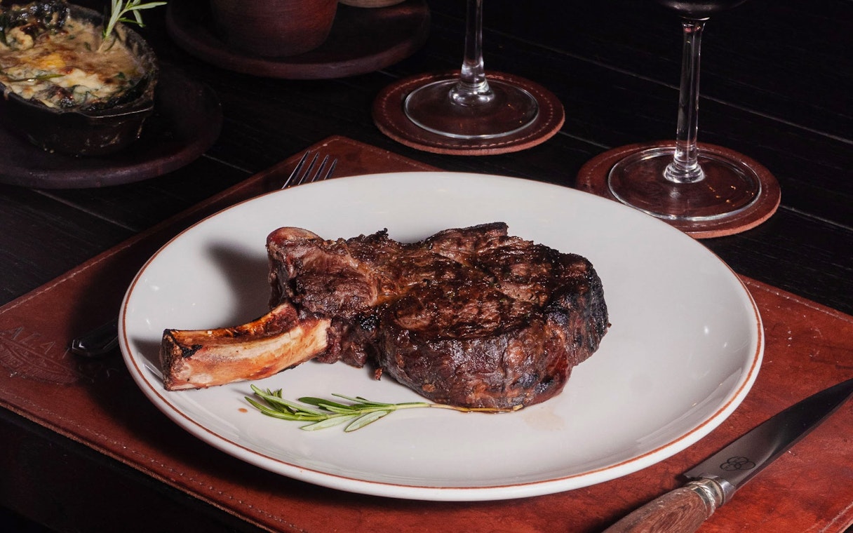 Dry-aged bone-in ribeye steak at Michelangelo Tango Show, Buenos Aires.