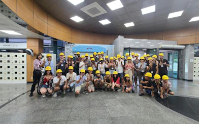 Tour group wearing yellow helmets at DMZ 3rd Tunnel entrance, South Korea.