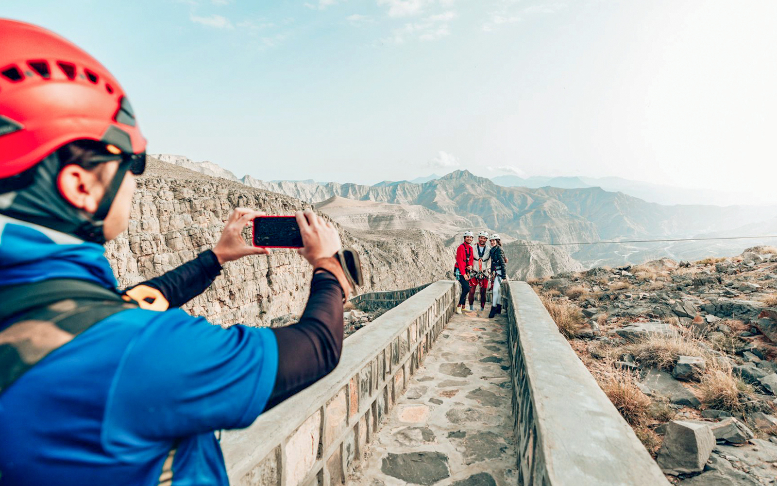 Visitors posing for a photo at Jais Adventure Centre, Jebel Jais mountains.