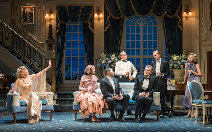 Cast of "Hay Fever" performing in a West End theater living room scene.