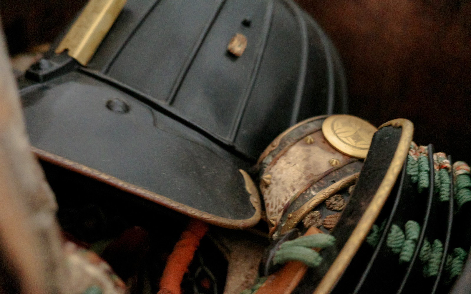 Edo period samurai armor with intricate details and gold accents.
